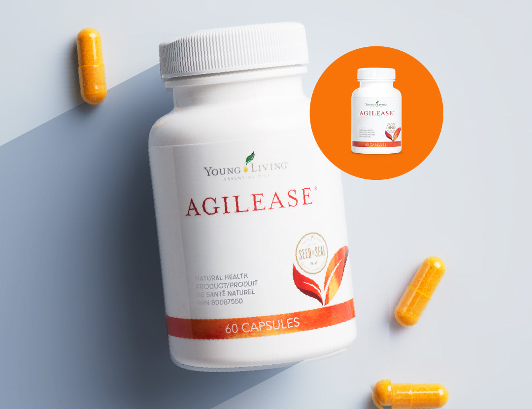A white bottle of Young Living Agilease capsules is shown on a light blue-gray background with scattered orange capsules. A circular inset shows the product label more closely.