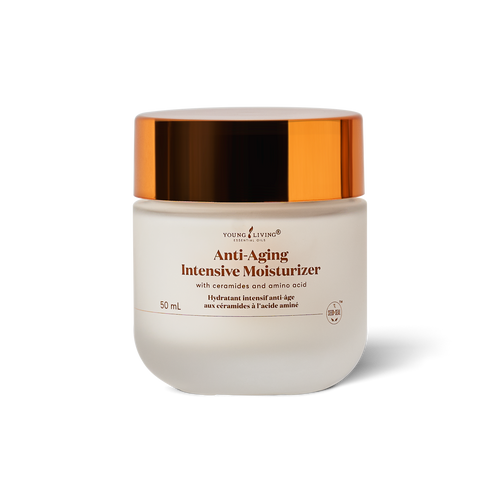 A 50 mL jar of Young Living Anti-Aging Intensive Moisturizer, featuring a frosted white glass container and a reflective metallic copper lid, set against a clean white background with a soft shadow.