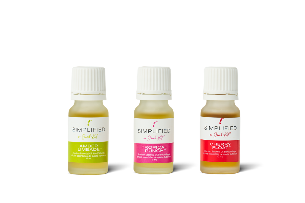 Three small bottles of Simplified Aromatics with different colored labels on a white background