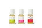 Three small bottles of Simplified Aromatics with different colored labels on a white background