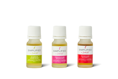 Three small bottles of Simplified Aromatics with different colored labels on a white background