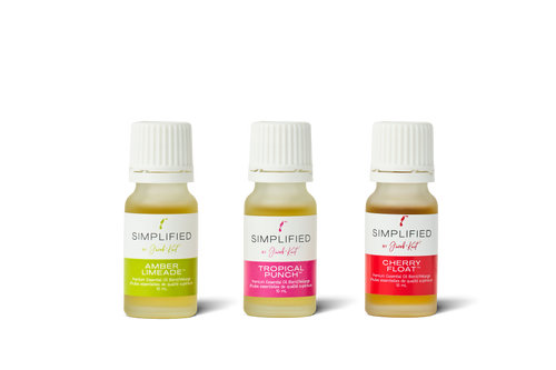 Three small bottles of Simplified Aromatics with different colored labels on a white background