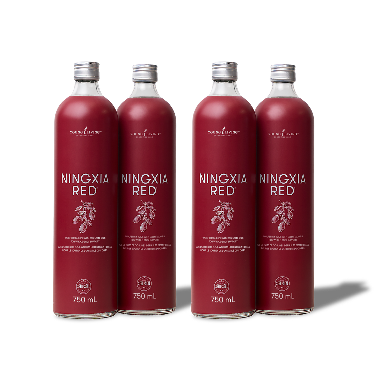 Four glass bottles of Young Living Ningxia Red arranged in a row on a white background, each bottle containing a deep red liquid and topped with a silver cap.