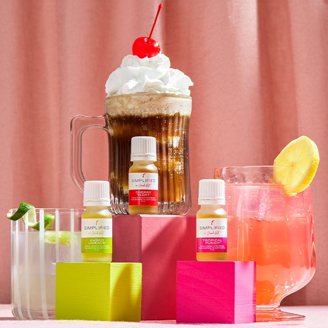 Assorted drinks with bottles labeled 'Dapurifed' against a pink curtain background