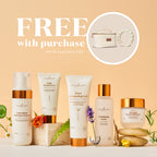 A promotional skincare bundle from Young Living featuring five products: Antioxidant Cleansing Cleanser, Light Moisturizer, Pure Cleansing Gel, Exfoliating Toner, and Exfoliating Treatment Cream. The products are arranged on a white surface with decorative botanicals and stones against a warm beige background, with text reading 'FREE with purchase' and a circular inset showing a quilted handbag and pearl bracelet.